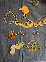 Overview of all jewelry pieces on blue cloth