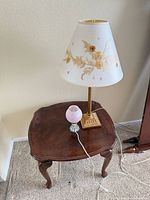 Side table with both lamps positioned on top