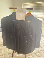 Two navy Alfred Dunhill pinstripe/windowpane wool jackets on hangers