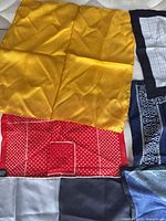 Overview showing yellow, red polka-dot, navy western, grid check and grey squares