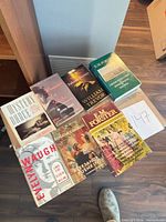 All nine books arranged on tabletop