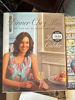 Front cover of Dinner Chez Moi hardcover cookbook