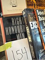 Spines showing Right Honourable Men, In Search of Excellence and lot reference number