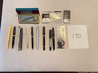 Overview of 9 pens, Patrician pencil box, converter, refill and cartridge