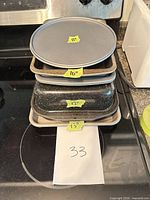Stacked pans showing size labels 8, 10, 12, 13 in