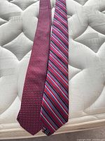 Both neckties laid flat showing patterns