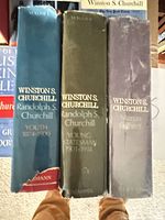 Spines of three official biography volumes showing titles and authors