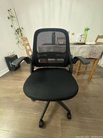 Front view of black mesh office chair