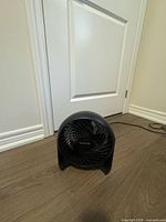 Front view of Honeywell black table fan