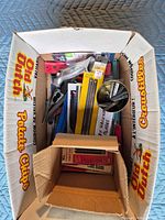 Box containing assorted carded blade packs and hacksaw frames