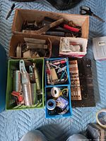 Overview of lot with bins containing tools, hardware, tapes, Motomaster box