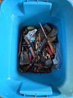 Blue tote containing assorted hand tools