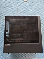 Left side view showing tempered glass panel and empty interior