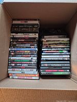 Box with two stacks of DVDs and Blu-rays