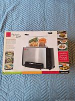 Front of box showing Ronco Ready Grill image and branding