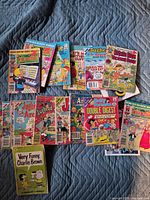 All comic digests spread on quilt showing variety of titles and condition