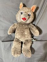 Front view of gray Violet the Wolf plush