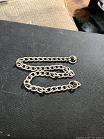 Full view of curb link bracelet laid flat