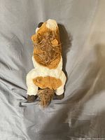 Top view of brown and white plush horse showing mane, tail and body coloration