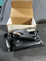 Embossing press, pouch and box grouped