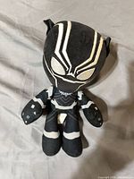Front view of Black Panther plush doll