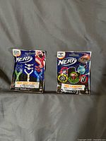 Front view of both sealed Nerf mystery bags