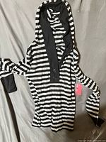 Front view showing stripes, hood, button placket