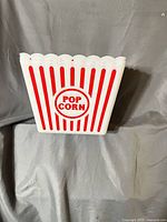 Front view showing red stripes and POP CORN logo