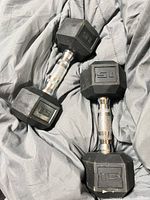 Pair of 15-lb rubber hex dumbbells on fabric