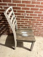 Chair side view showing two-tone finish and seat wear