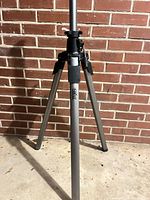 Lower section of tripod legs displaying aluminum finish and flip locks