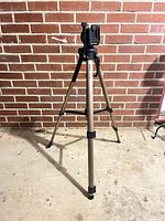 Full view of Vivitar VPT-360 tripod standing with legs extended