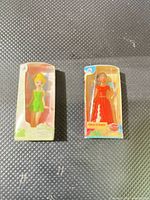 Both miniature boxed dolls side by side