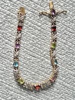 Full view of sterling silver bracelet with multicoloured stones