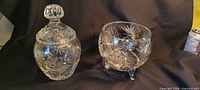 Both crystal pieces side by side showing overall forms and pinwheel cuts