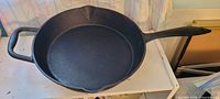 Top view of Lagostina cast iron fry pan showing interior and handles