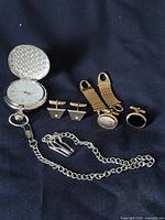 Entire lot: open pocket watch, chain, cufflinks, extenders