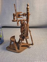 side view showing wheel, stool and flyer