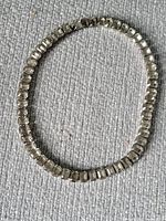Full view of necklace in oval arrangement showing rhinestone links