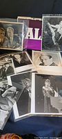 Overview of assorted promotional photographs spread out