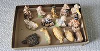 Overview of all 14 Wade miniature figurines in box