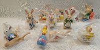 Group shot of wrapped wooden animal figurines displayed on table