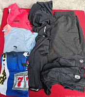 Group shot of all seven clothing items laid flat