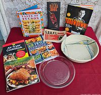 Group shot of all cookbooks, glass pie plate and stoneware bowl