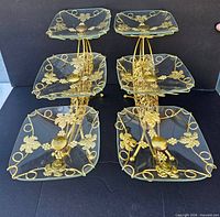 Front view of complete tiered stand with six glass plates