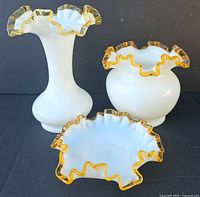 Three Fenton Amber Crest pieces: vase, rose bowl, dish