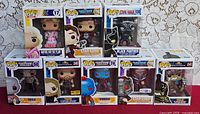 Group shot of all eight boxed Funko Pop figures