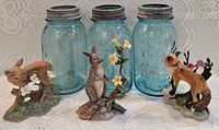 Group view showing three blue Ball jars and three Lenox animal figurines