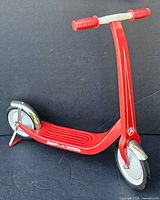Side view of red miniature Radio Flyer scooter showing full profile