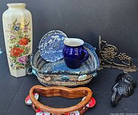 Full group view showing vase, tambourine, basket, plate, creamer, cast-iron bracket and owl hook